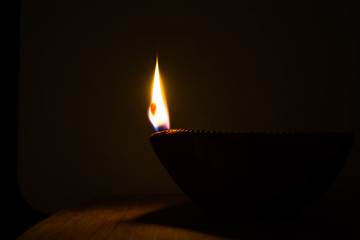 diwali diya flame isolated in the dark