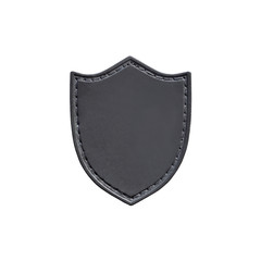 Leather patch in the form of a shield isolated on white background. Chevron