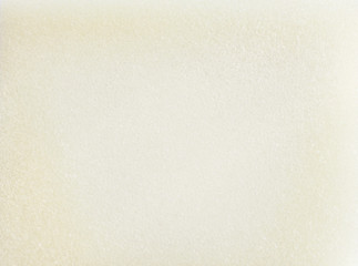 White foam rubber background, grainy texture