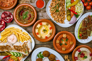 Obraz na płótnie Canvas assorted Turkish dishes, hummus, muhamara, mutabal, falafel, shawarma