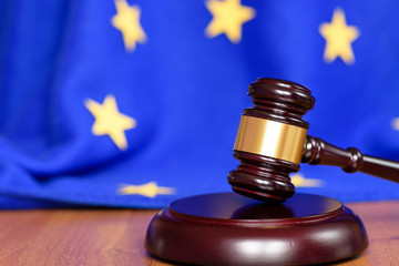 Judicial justice and law. European Court of Justice over the UK. Judge's gavel on the table and the...