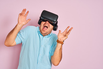 Young plus size man playing virtual reality game using goggles