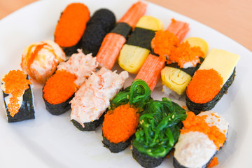 Japanese food sushi roll rice with tobiko egg red caviar cream sauce nori seaweed in the restaurant sashimi sushi menu set Japanese cuisine fresh ingredients mix various types