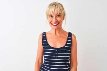 Middle age woman wearing casual striped t-shirt standing over isolated white background with a happy and cool smile on face. Lucky person.