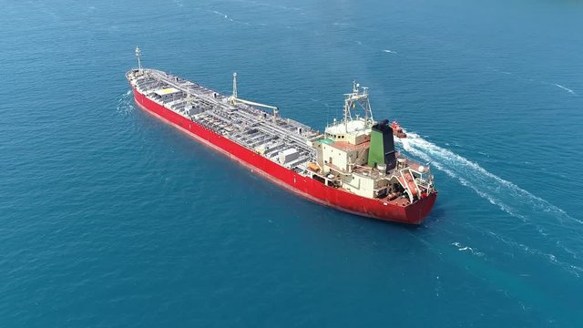 Aerial tracking shot of an oil chemical tanker cruising along the Bosporus Sea. A 182 meters long chemical tanker ship
