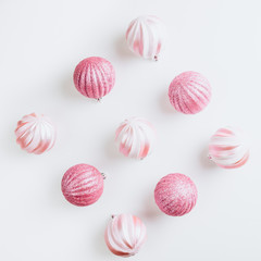 Pink Christmas Balls on white background. Top view. Copy space. Flat lay. Christmas minimal concept.