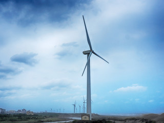 Beautiful dune and windmill in the beach dunes hill at Guanyin, Taiwan   