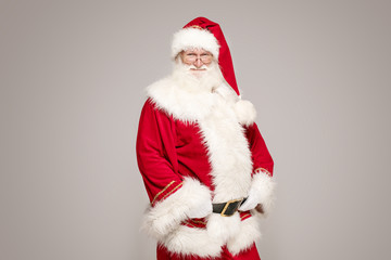 Real Santa Claus in red cap posing.