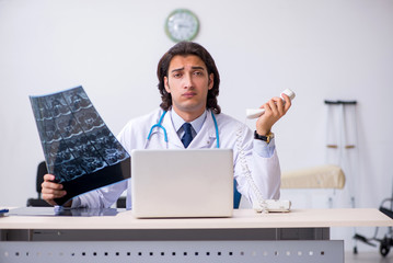 Young male doctor radiologist working in the clinic