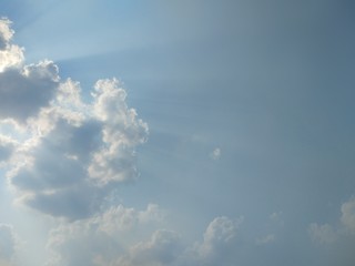 Natural light from the sun with blue sky and white clouds.