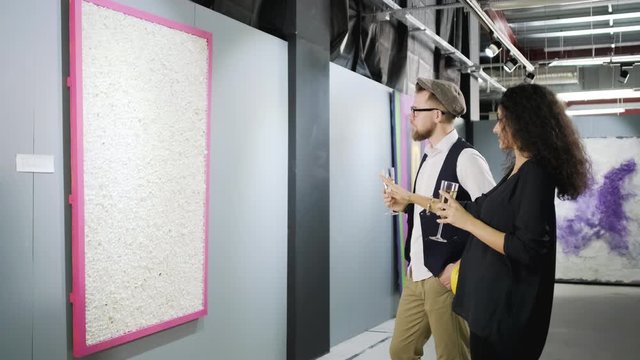 Picture gallery visitors talking about the art