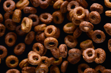 morning breakfast, round chocolate. frozen in the air on a black background for design