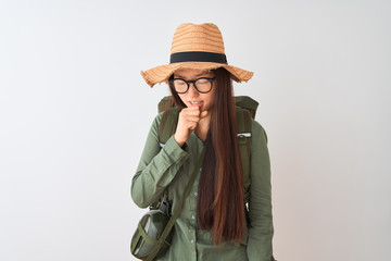 Chinese hiker woman wearing canteen hat glasses backpack over isolated white background feeling unwell and coughing as symptom for cold or bronchitis. Healthcare concept.