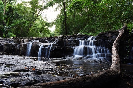 Natural waterfall  and green trees Than Ngam Waterfall