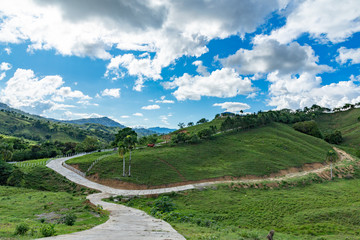 Fototapeta na wymiar Mountains view, tropical landscape, palm trees, sky scape, sunlight through clouds, Dominican Republic 
