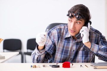 Young male jeweler at workshop