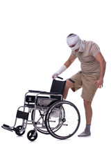 Obraz premium Injured man in wheel-chair isolated on white