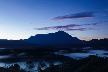 Amazing Beautiful Nature landscape view of Sunrise with  nature misty foggy and Mount Kinabalu,...