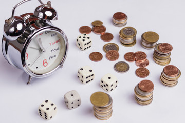 coins, clock and dice; economy, time and chance