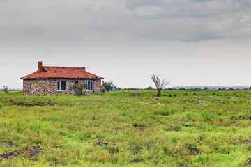 Fototapeta na wymiar Abandoned houses in the meadow