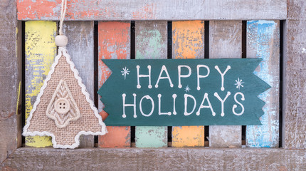 Fototapeta premium happy Holiday written on wooden background