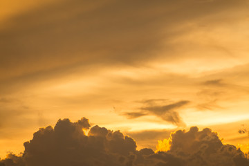 Golden sky and clouds before sunset