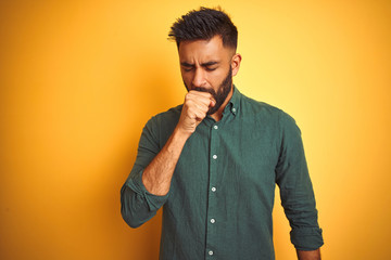 Fototapeta premium Young indian businessman wearing elegant shirt standing over isolated white background feeling unwell and coughing as symptom for cold or bronchitis. Healthcare concept.