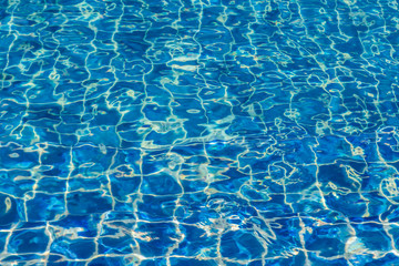 Blue color water in swimming pool rippled