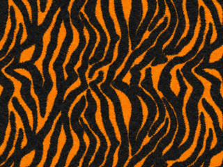 Balck-Orange Tiger Stripes Fur texture, carpet animal skin background, black and orange theme color, look smooth, fluffy and soft, fashion clothes textile concept. Design by using photoshop brush.