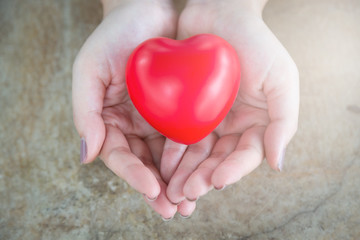 Fototapeta premium Woman hold red heart