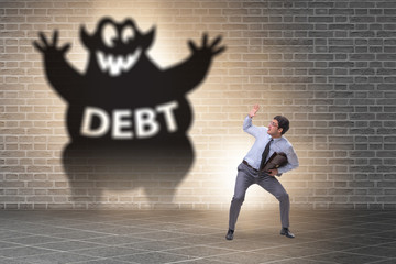 Businessman in debt and loan concept