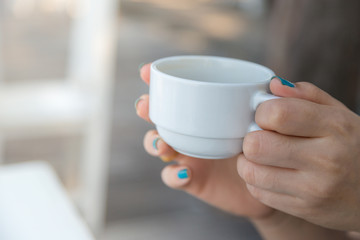 Woman drinking coffee in hand