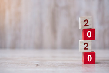 2020 wooden Blocks arrange on table background. Business, Risk Management, Resolution, strategy,...