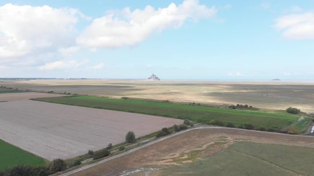 Manche countryside view with blurry mont saint michel in background, Manche, France 2018-09-01