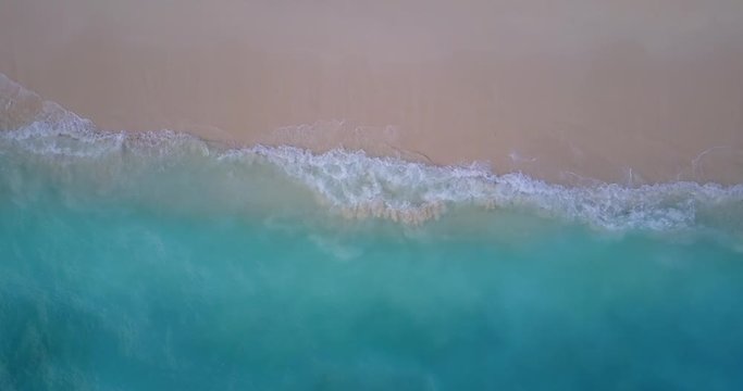 Waves Break On White Sand Beach. Sea Waves tropical ocean background