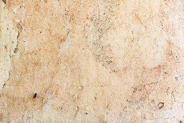 Texture of a concrete wall with cracks and scratches which can be used as a background