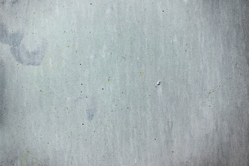 Texture of a concrete wall with cracks and scratches which can be used as a background
