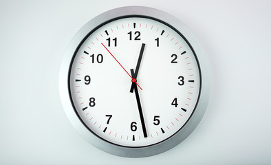 Gray wall clock face beginning of time 12.28 am or pm on White background, Copy space for your text, Time concept..