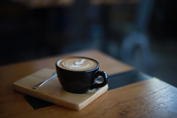 cup of coffee latte art in cafe