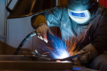 Industrial steel welder in factory welder, craftsman