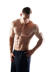 Fototapeta premium Strong, fit and sporty bodybuilder man over white background. Sport and fitness.