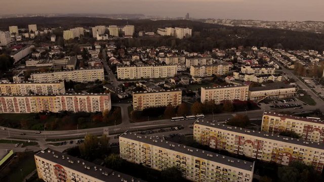 Aerial photos over apartment blocks on sunset, old housing estate near the forest in the city center, quiet neighborhood
