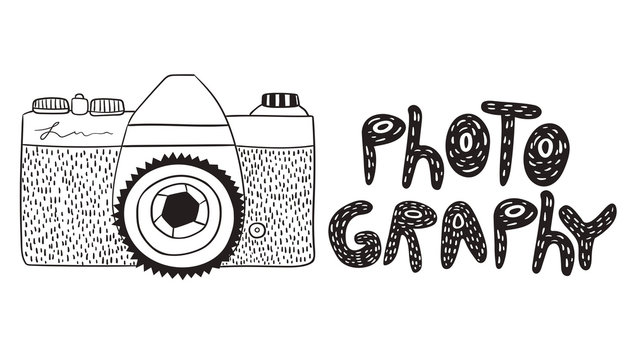 Photo camera in doodle style with the inscription isolated on white background.