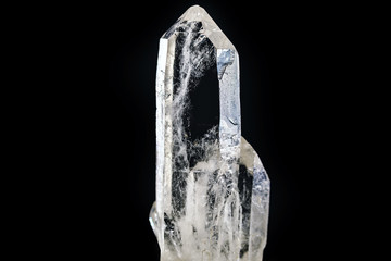 Macro photography of natural minerals from geological collection - clear quartz stone (rhinestone) on isolated black background. - obrazy, fototapety, plakaty