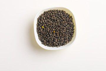 black gram seed or udad beans in bowl on white background 