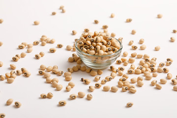 Black eyed seeds or chawali seeds in glass bowl on white background 
