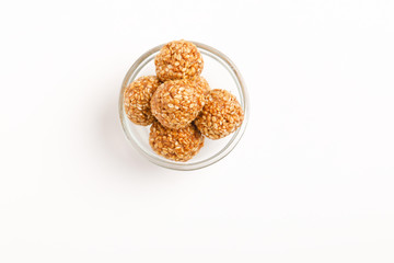 Indian sweet dish,Sesame seeds ball or called in hindi, til ke laddu on white background 