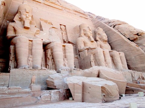 The fallen Pharaoh head on the ground before the Great Temple, Abu Simbel in Egyptian, in Nubia village in Egypt. The complex is part of the UNESCO World Heritage Site known as the Nubian Monuments.  