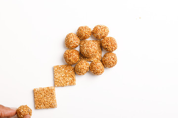 Indian sweet dish,Sesame seeds ball or called in hindi, til ke laddu on white background 