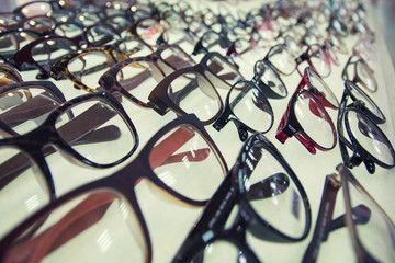 Row of glasses at an opticians. Eyeglasses shop.